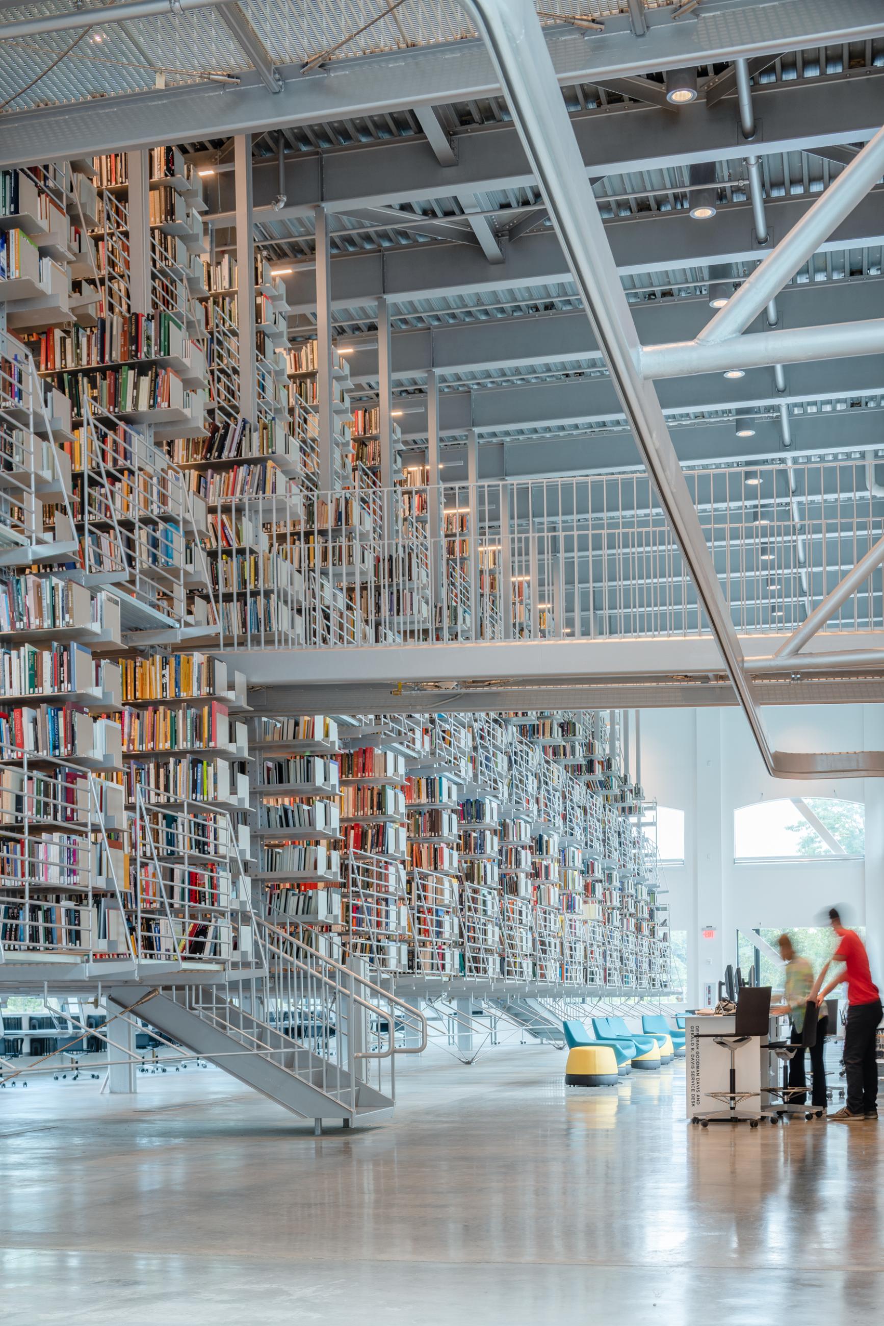 Bridges connect the suspended Cornell stack volume to study and seminar areas